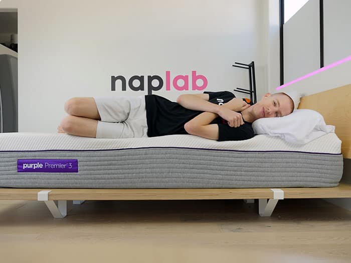 Purple Hybrid Premier 3 side sleeping on edge