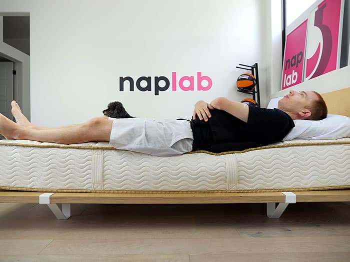 Saatva Memory Foam Hybrid edge support - back sleeping with vest