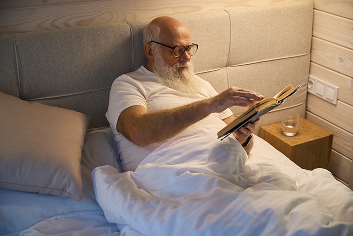 Senior Man Read With Light